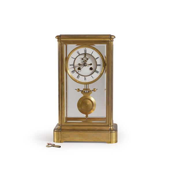 Pendola da tavolo in teca. XX secolo