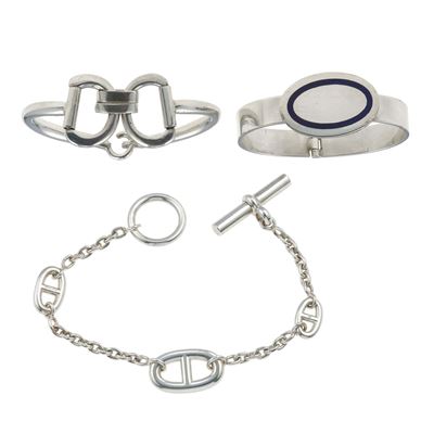 Montature in argento, lotto composto da tre bracciali (uno firmato Hermès)