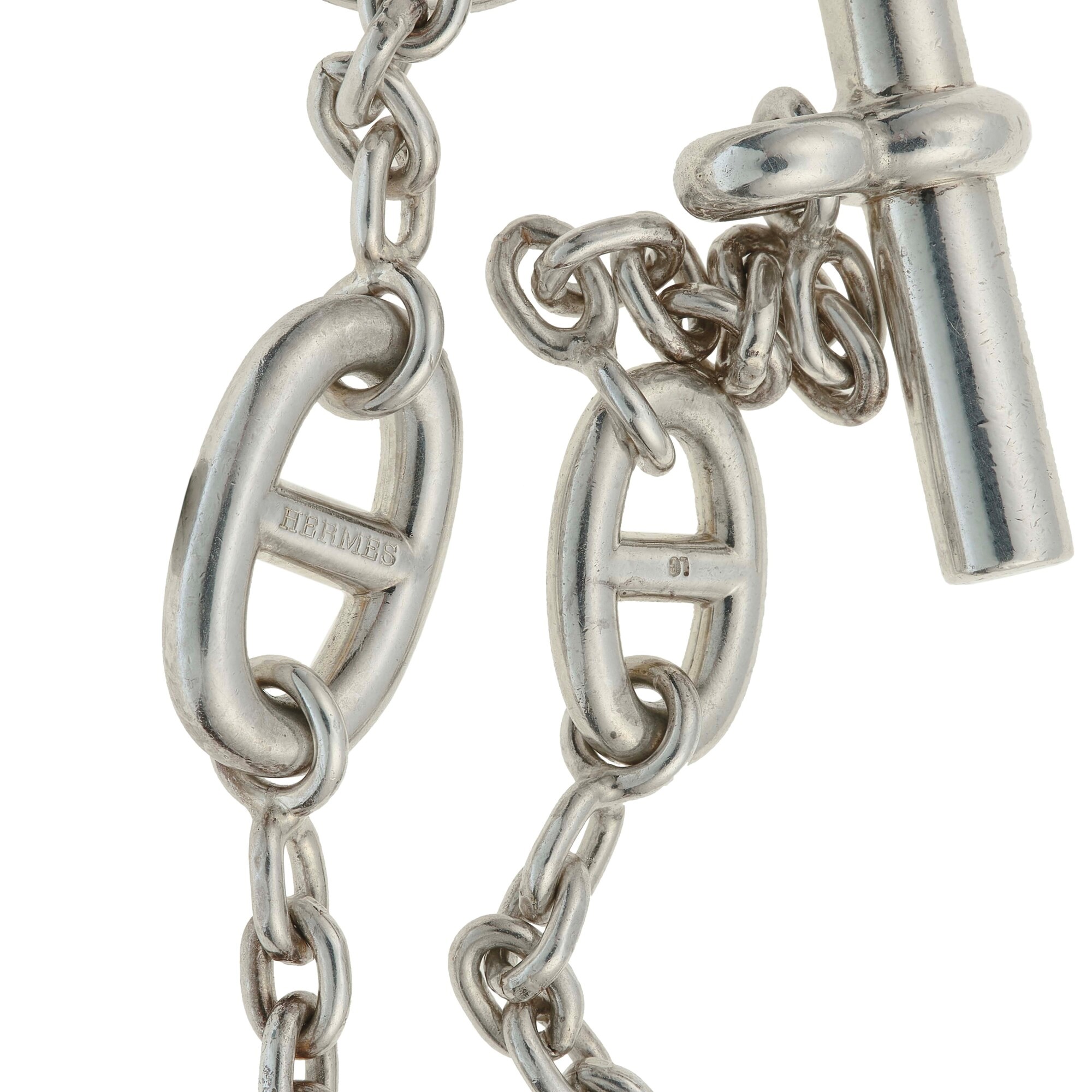 Montature in argento, lotto composto da tre bracciali (uno firmato Hermès)