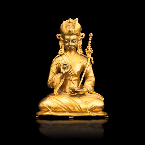 Gilded bronze figure depicting Padmasambhava crowned with sword and vajra in hand, Tibet, 18th century