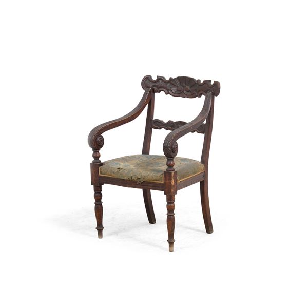 Poltrona tipo "Peters" in legno intagliato, Genova XIX secolo