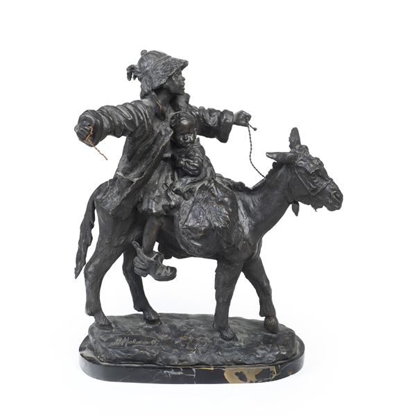 Giovane e bambino su asino