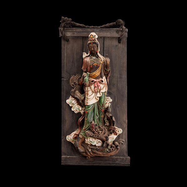Figure of Guanyin in polychrome glazed stoneware on a wooden base with semi-precious stone inlays, manufactured in “Simiao,” China, late 19th century