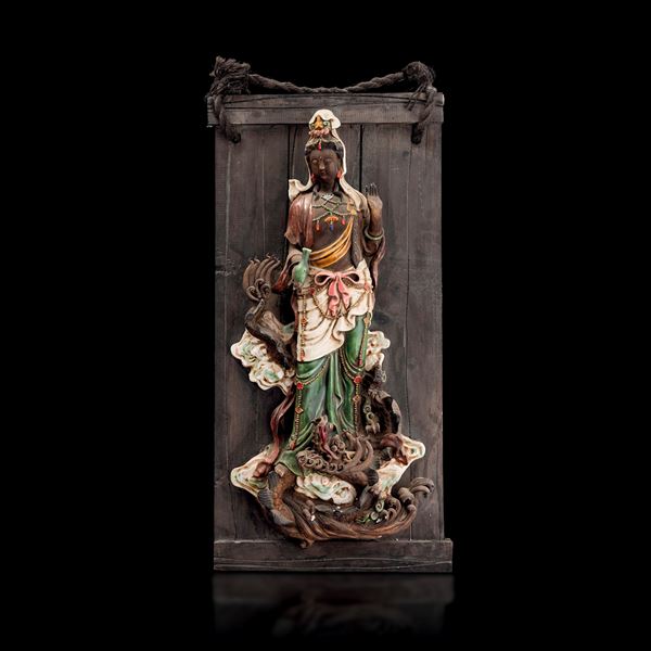 Figure of Guanyin in polychrome glazed stoneware on a wooden base with semi-precious stone inlays, manufactured in “Simiao,” China, late 19th century