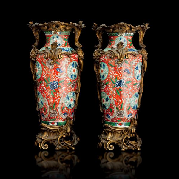 Pair of Green Family porcelain vases with floral decorations within reserves, dragons, and plant motifs with bronze mounts, China, Qing Dynasty, 19th century