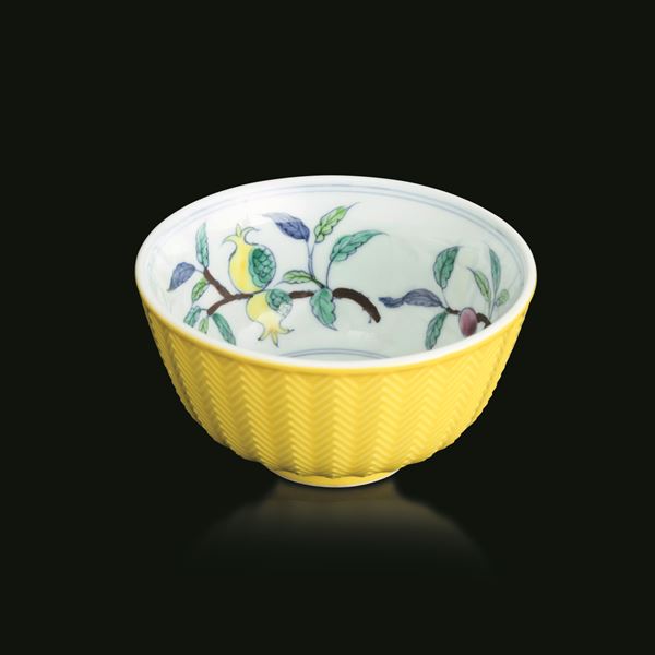Porcelain bowl with yellow base, geometric relief decorations, and plant decorations inside, China, Qing Dynasty, 19th century