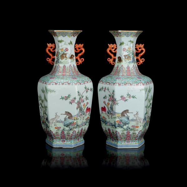 Pair of Famiglia Rosa porcelain vases with naturalistic motifs featuring animals, floral decorations, and two dragon-shaped handles, China, Qing Dynasty, 19th century