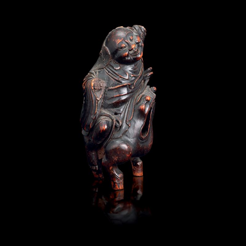 Figura in legno di frutto raffigurante saggio a cavallo di una rana, Cina, XIX secolo  - Asta Fine Asian Works of Art - Cambi Casa d'Aste