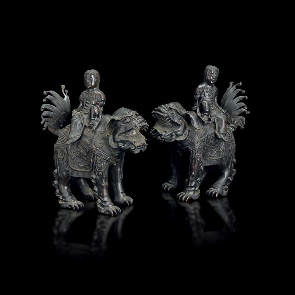 Pair of bronze incense burners depicting figures standing on Pho dogs, China, Ming Dynasty, 17th century