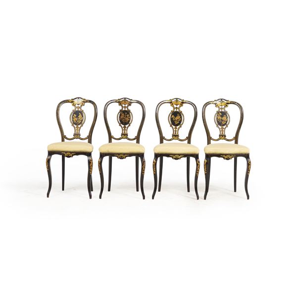 Quattro sedie in legno ebanizzato e dorato. XIX secolo