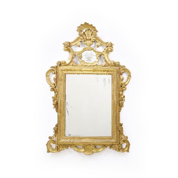 Specchiera in legno intagliato e dorato. XVIII-XIX secolo