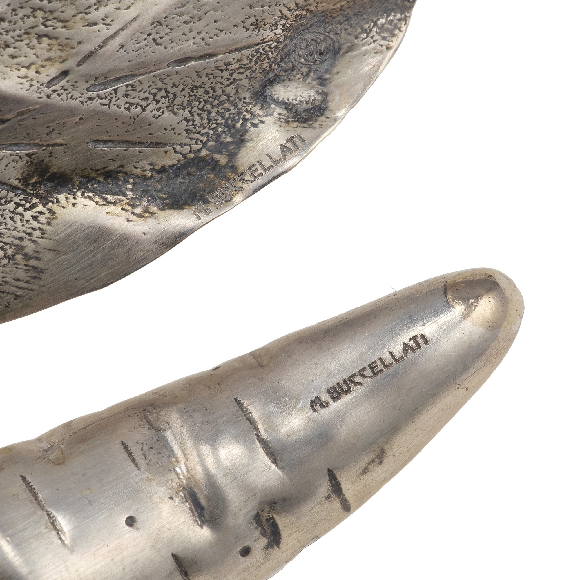 M. Buccellati, Due oggetti decorativi in argento a soggetto vegetale