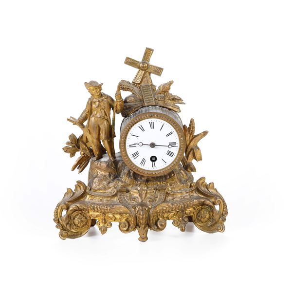 Pendola da tavolo in bronzo dorato. XIX-XX secolo