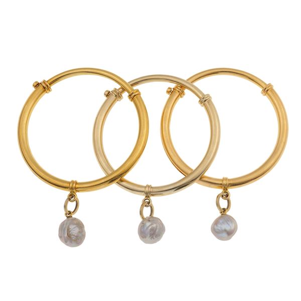 Pomellato. Tre bracciali rigidi con perle barocche