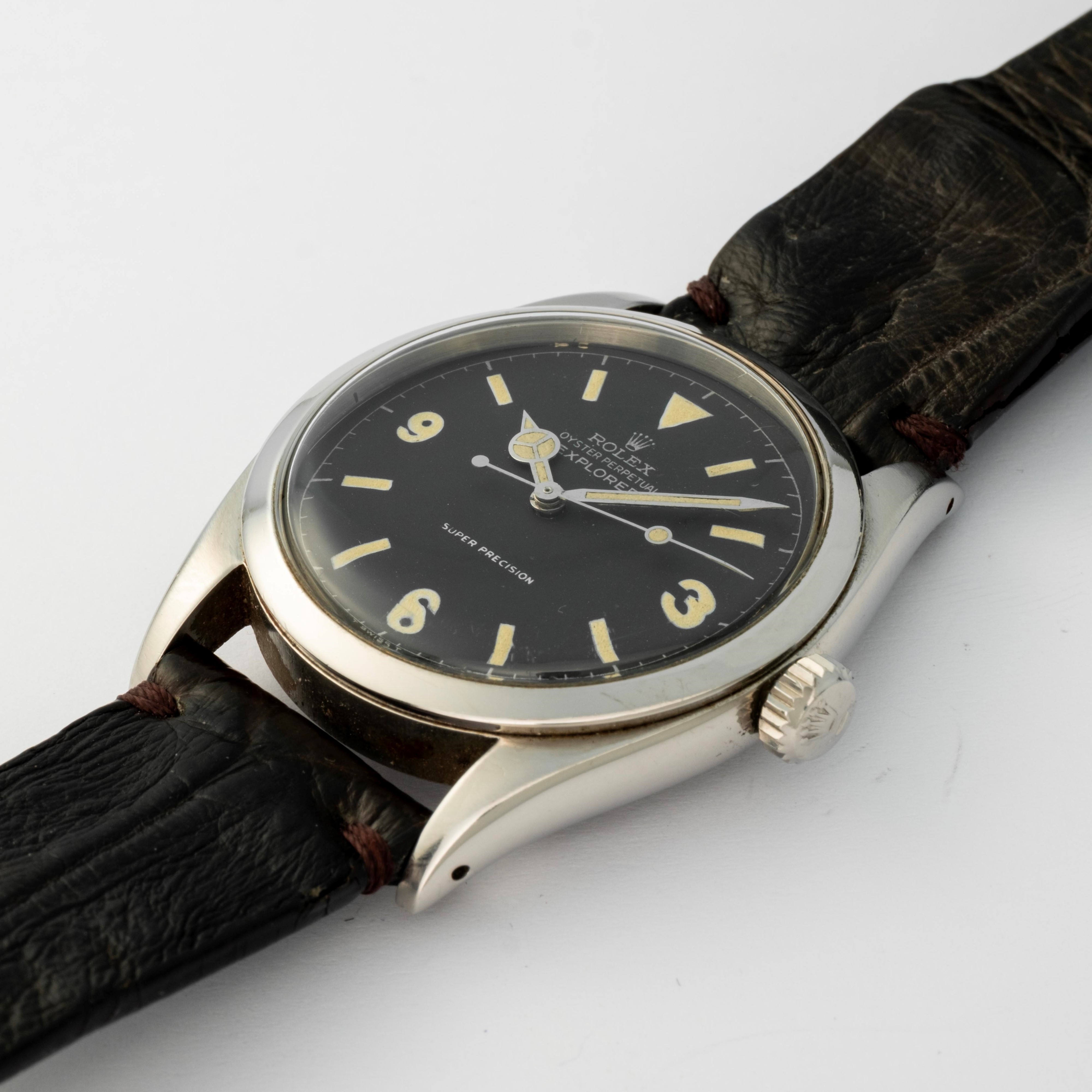 Rolex - Ovettone Explorer ref. 6298 in acciaio con quadrante nero e grafica argentata, circa 1953