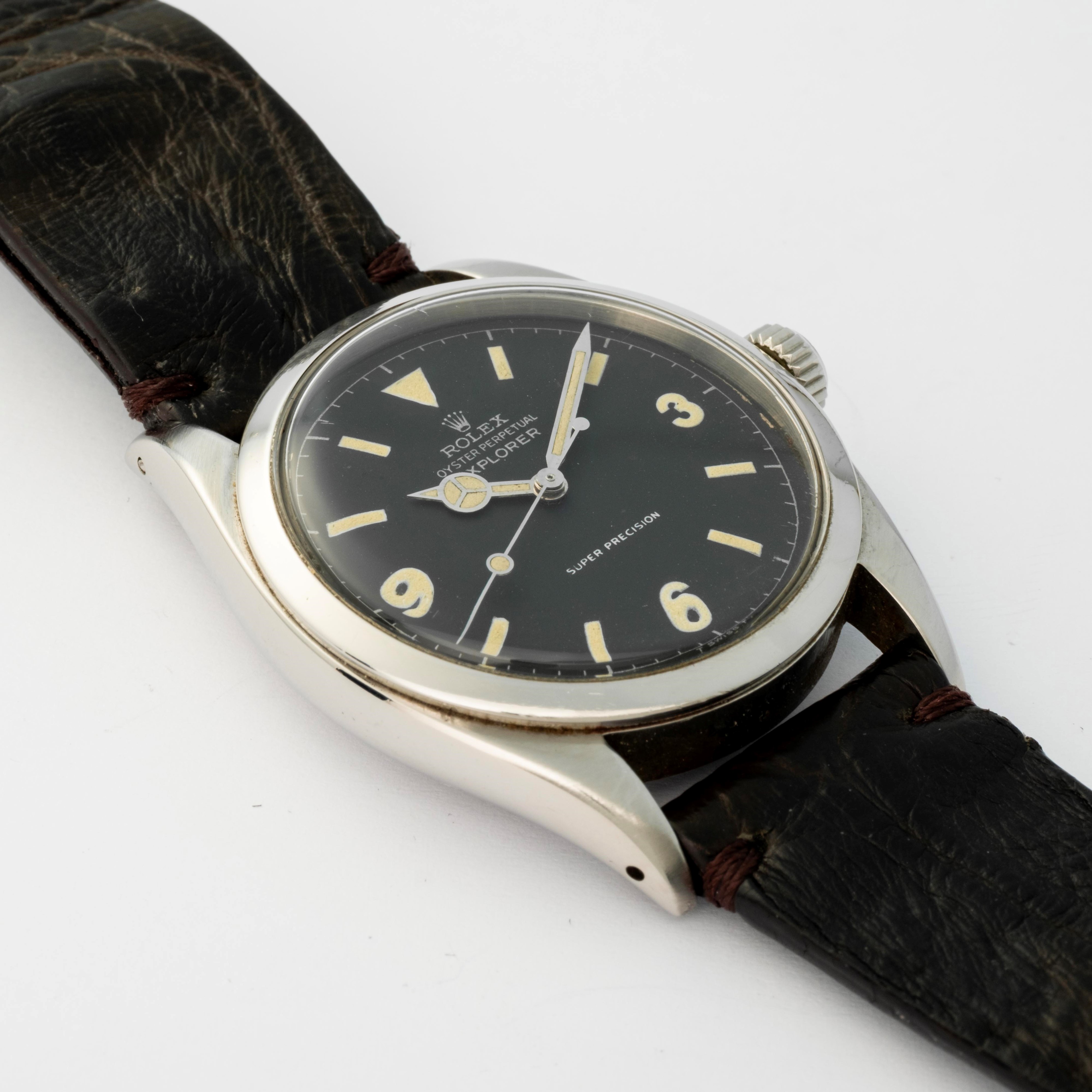 Rolex - Ovettone Explorer ref. 6298 in acciaio con quadrante nero e grafica argentata, circa 1953