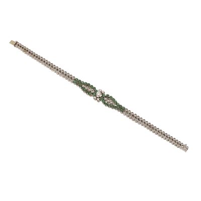 Bracciale in oro bianco 750/1000 con piccoli diamanti e smeraldi centrali