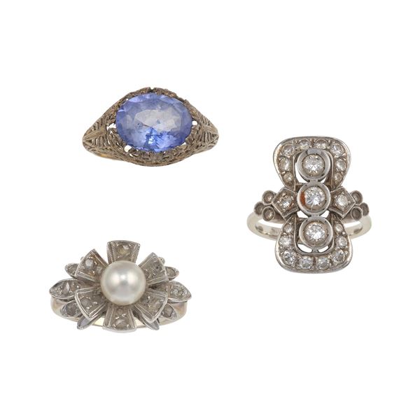 Three diamond, pearl, synthetic gem and gold rings. Small damages