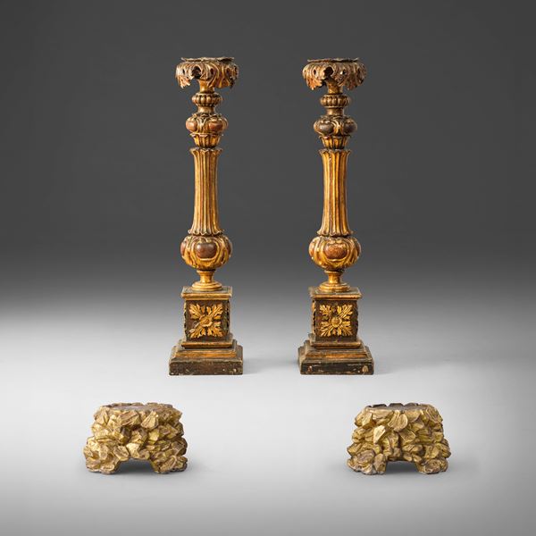 Coppia di torcieri in legno intagliato e dorato. XVIII-XIX secolo