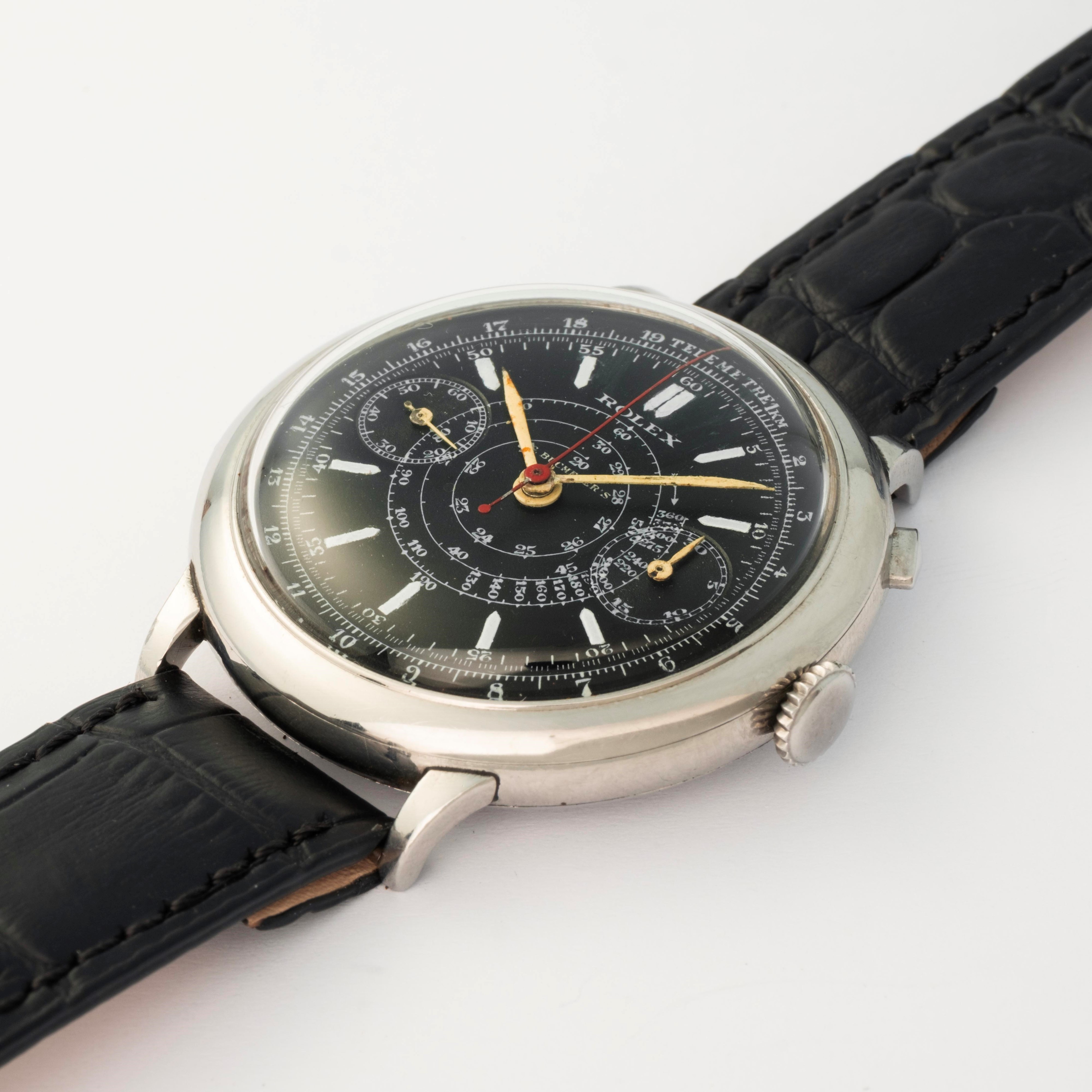 Rolex - Cronografo monopulsante ref. 2021 in acciaio con quadrante nero firmato Bucherer’s, circa...