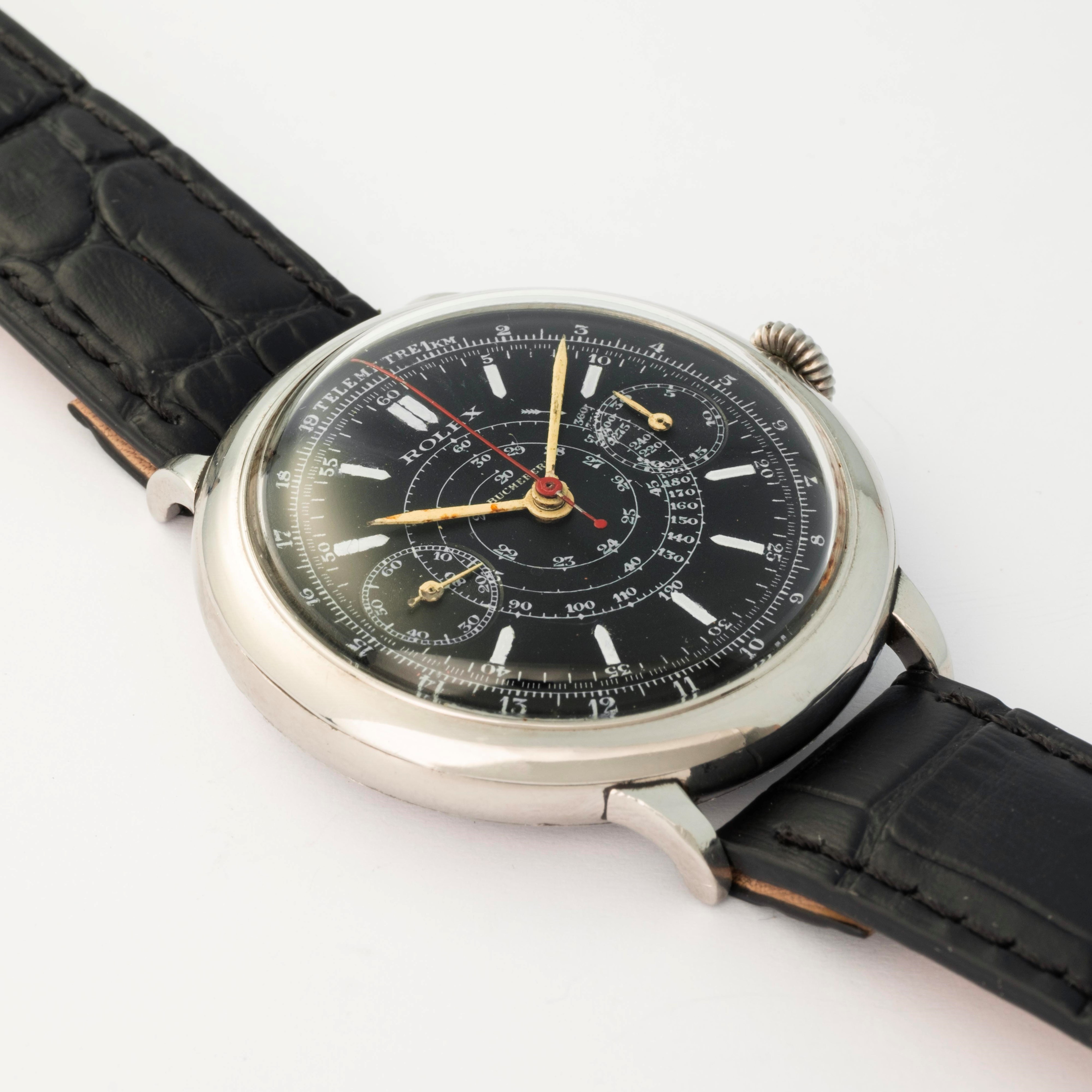Rolex - Cronografo monopulsante ref. 2021 in acciaio con quadrante nero firmato Bucherer’s, circa...
