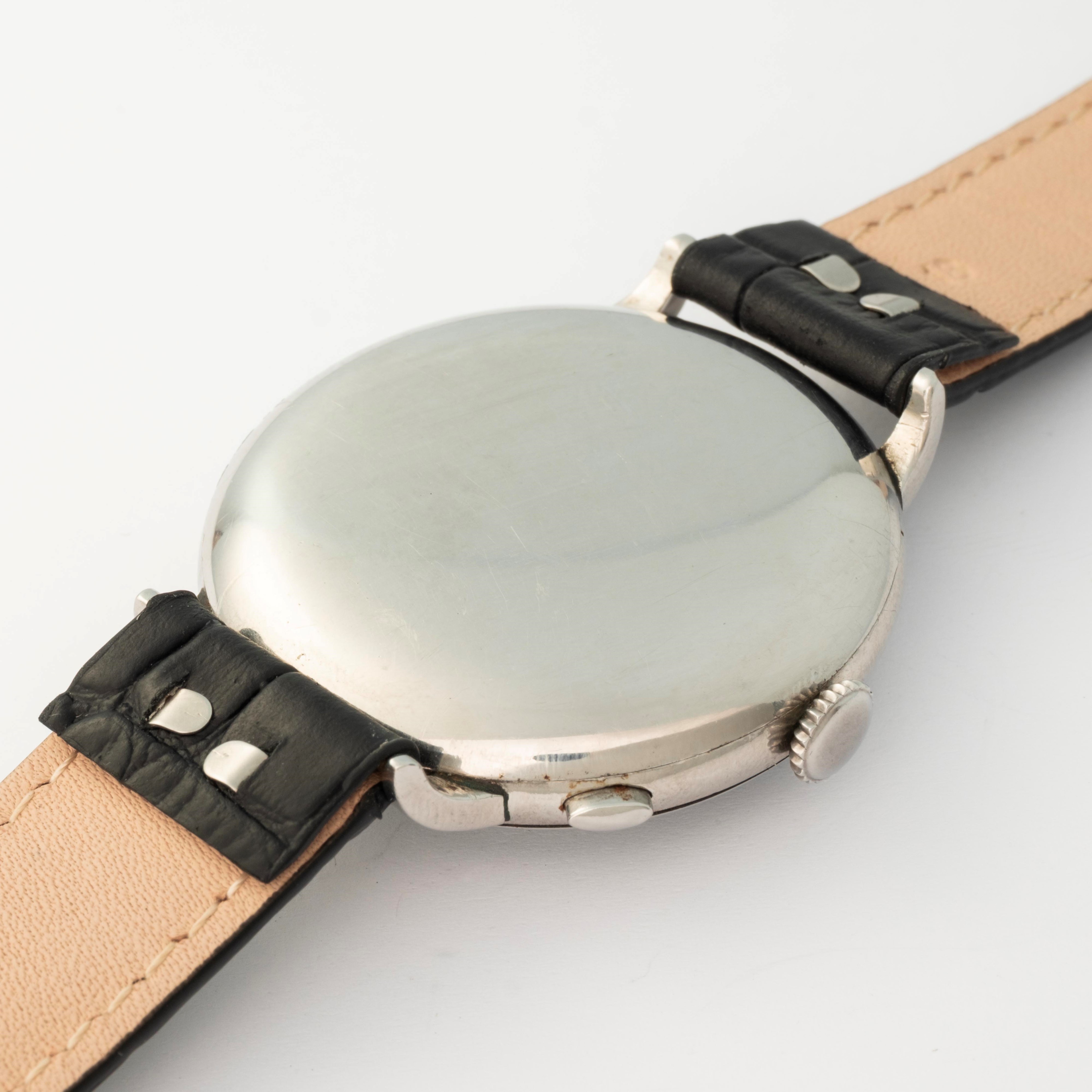 Rolex - Cronografo monopulsante ref. 2021 in acciaio con quadrante nero firmato Bucherer’s, circa...