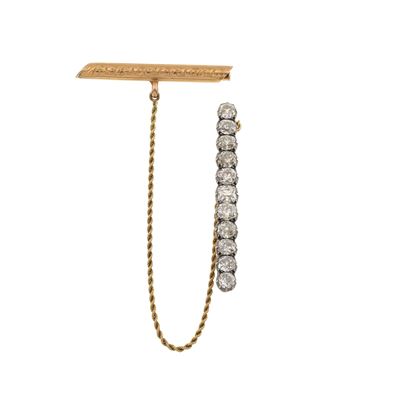 Spilla con undici diamanti di vecchio taglio, oro giallo e argento, ct 5.50 circa