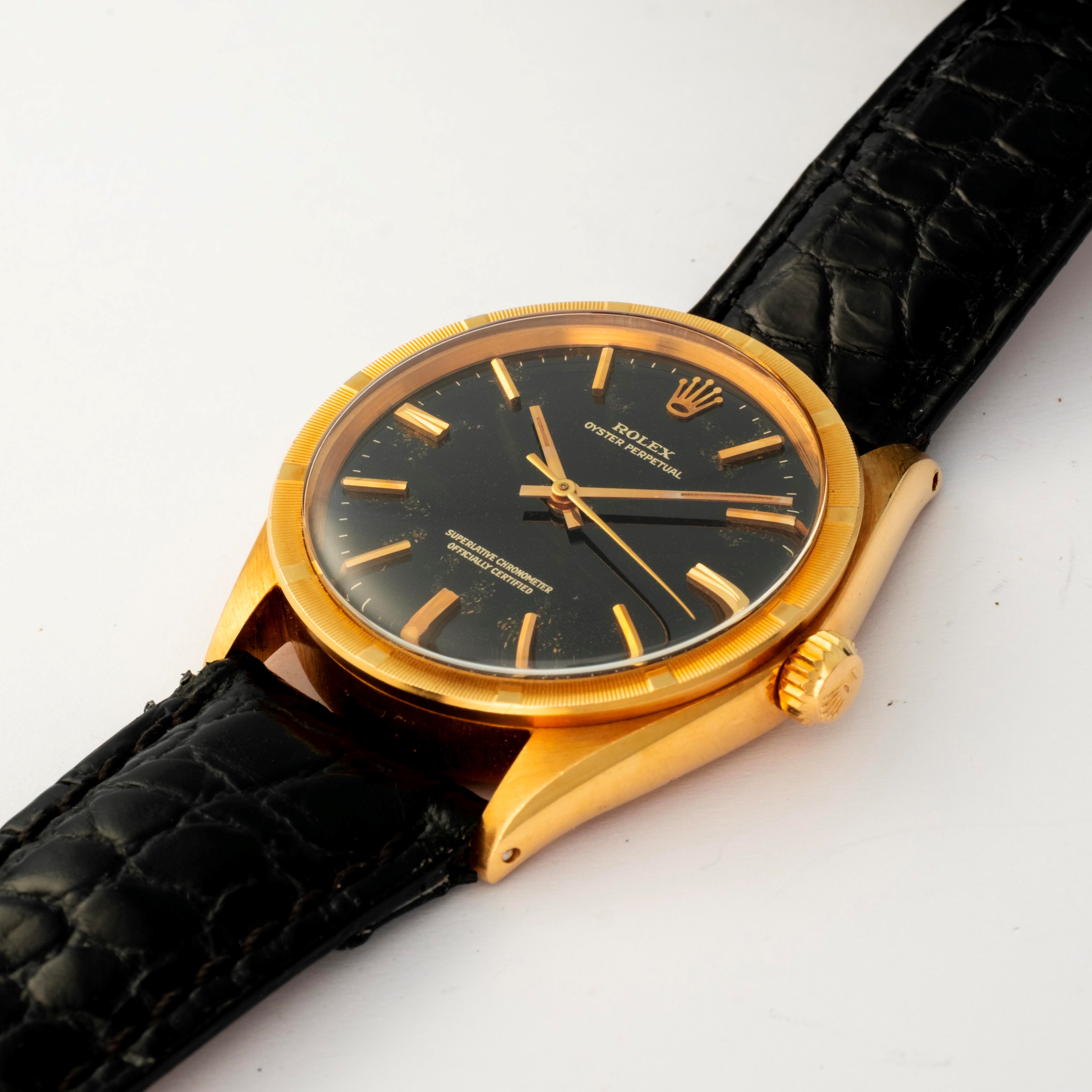Rolex - Oyster Perpetual ref. 1007 in oro giallo 18k con quadrante nero, circa 1965