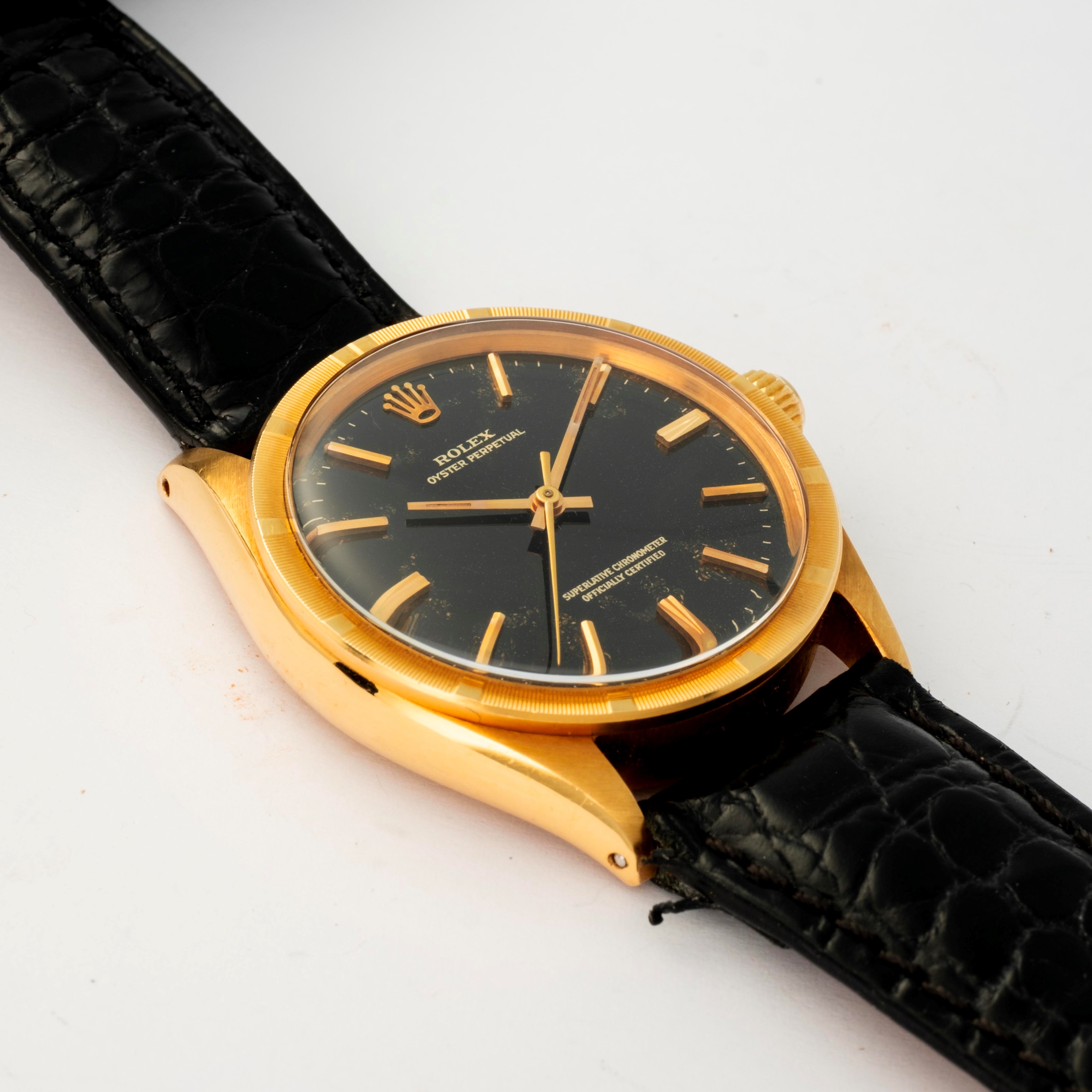Rolex - Oyster Perpetual ref. 1007 in oro giallo 18k con quadrante nero, circa 1965
