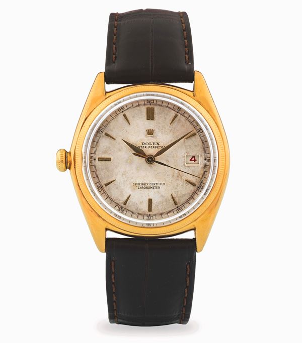 Rolex - Oyster Perpetual “Left-Handed” Ovettone ref. 4467, in yellow gold 18k, with grené dial and applied indexes, circa 1946