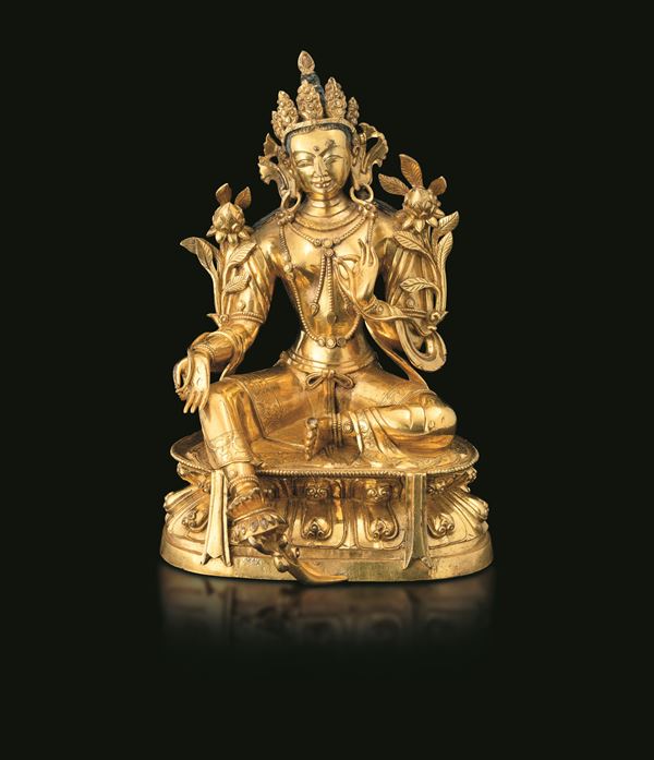Gilt bronze figure of Tara seated on a double lotus base with traces of polychrome decoration, Tibet, 18th century.