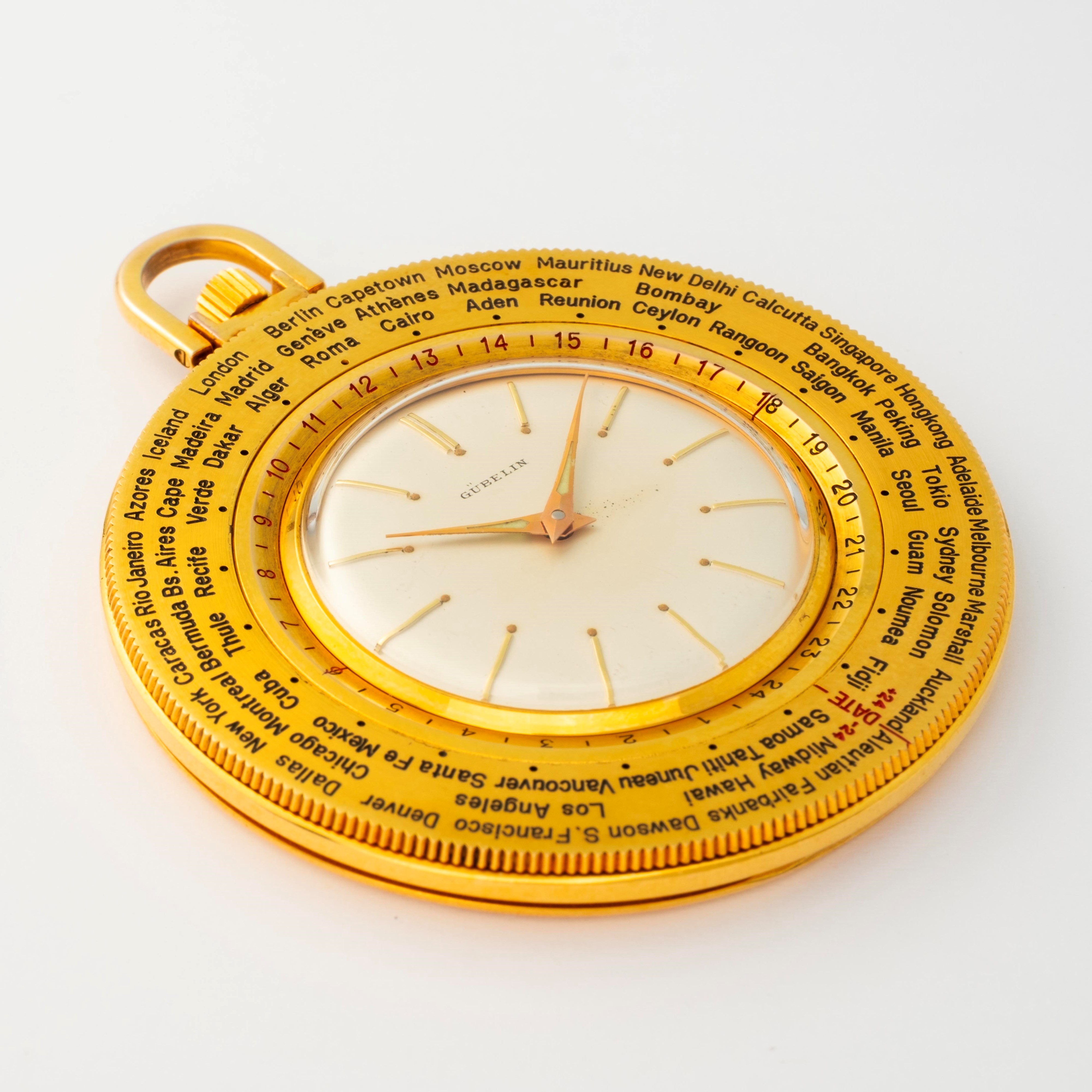 Gübelin - Tasca 'World time' in ottone dorato con quadrante argenté e ghiera girevole per 24 fusi...