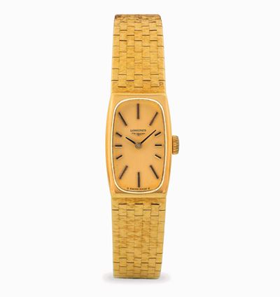 Tonneau in oro giallo 18k con bracciale integrato e quadrante champagne, circa 1950