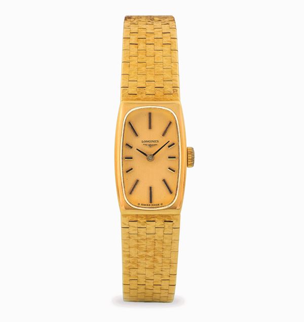 Longines - Tonneau in yellow gold 18k with integrated bracelet, champagne dial with applied indexes, circa 1950