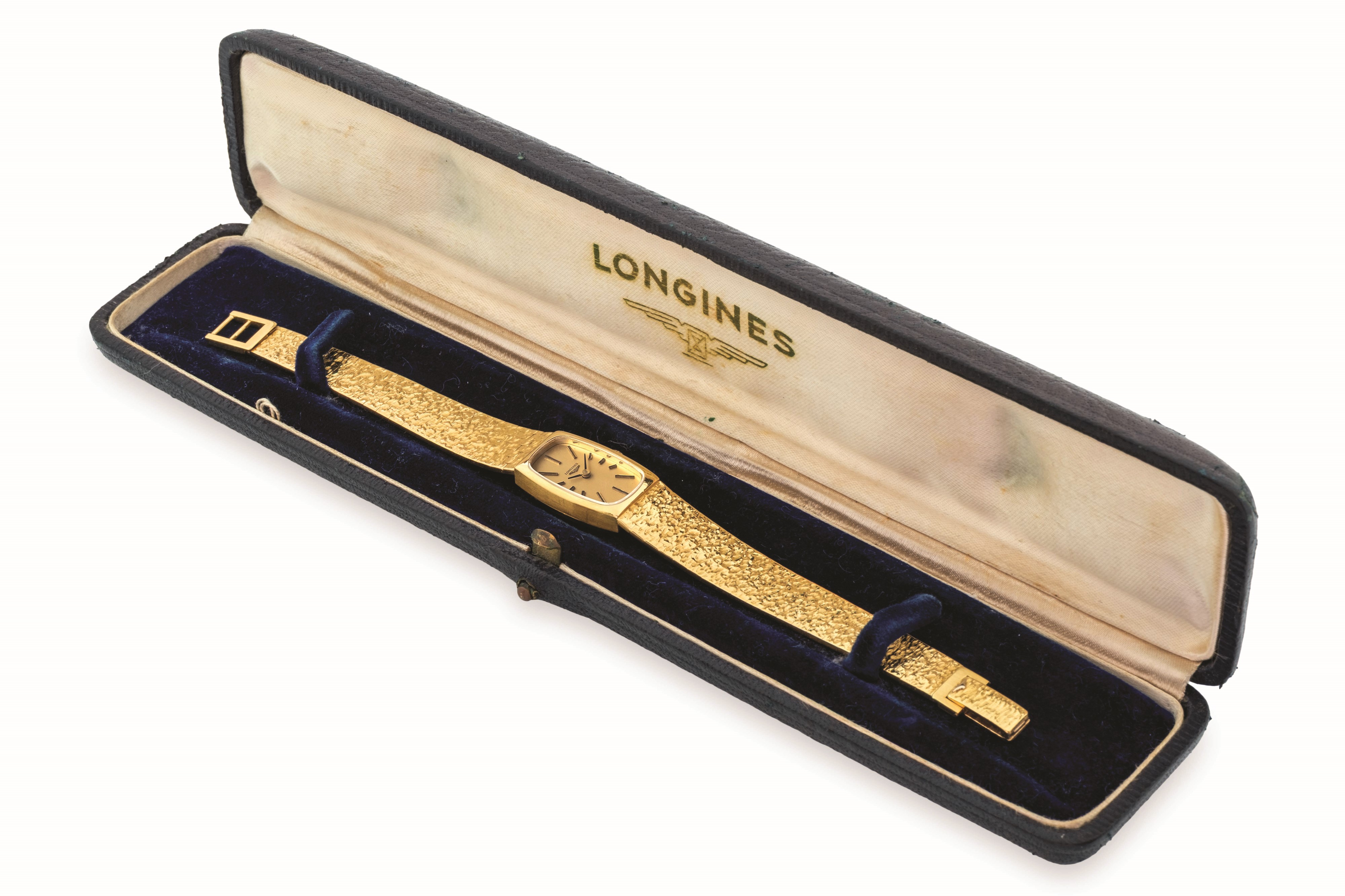Longines - Tonneau in oro giallo 18k con bracciale integrato e quadrante champagne, circa 1950
