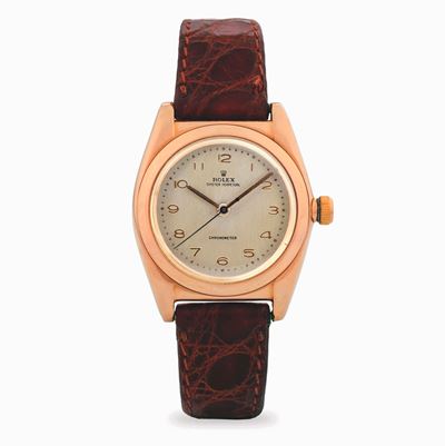 Rolex, Oyster Perpetual Ovetto in oro giallo 14k, quadrante champagne, circa 1948