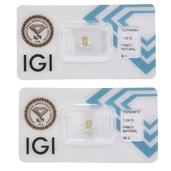Coppia di diamanti fancy yellow, taglio rettangolare ad angoli tronchi, di ct 1.18 e 1.24, caratteristiche interne SI1 e VS2, fluorescenze UV molto lieve e nulla