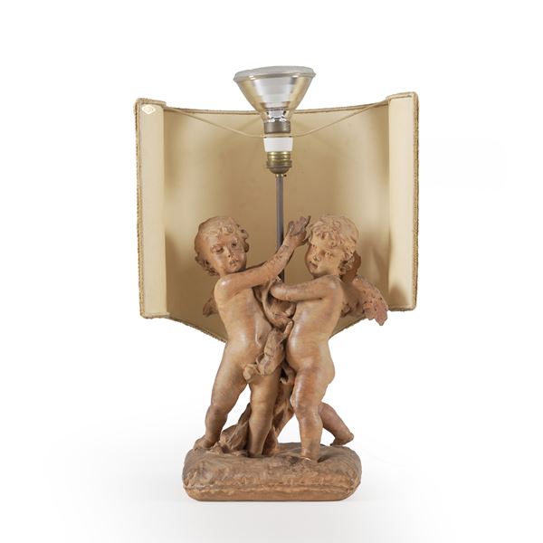 Scultura in terracotta raffigurante putti