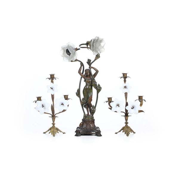 Due candelabri con fiori in opalina e una lampada a due braccia in metallo con figura femminile, inizio XX secolo