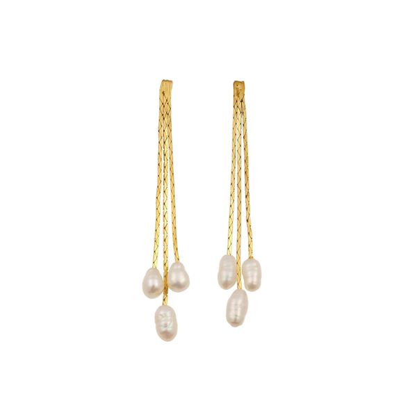 Pair of pearl and gold earrings