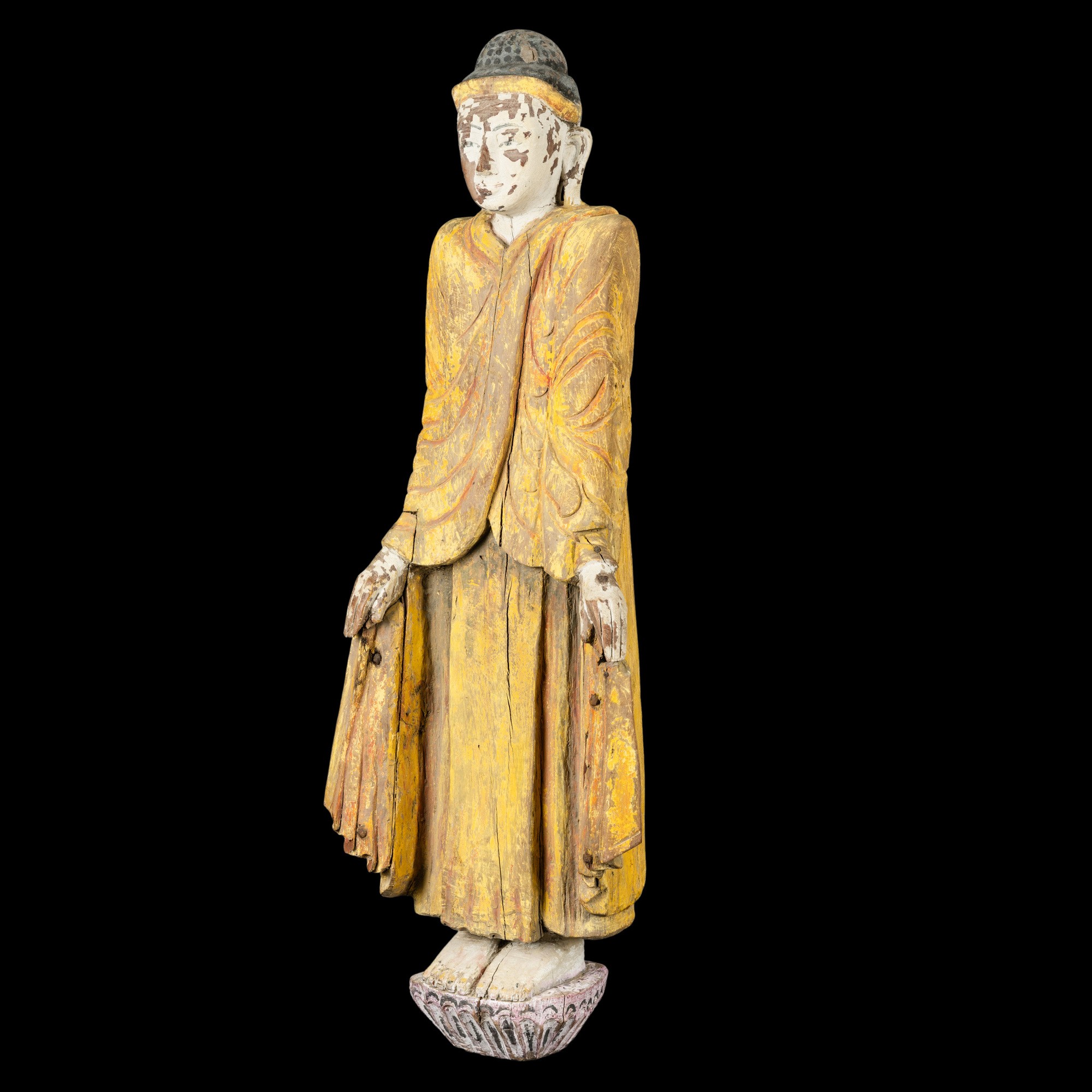 Figura di Buddha stante in legno con tracce di policromia, Birmania, XIX secolo