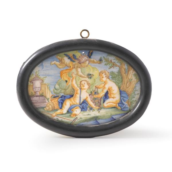 Targa ovale con putti.<BR>Italia centrale, XX secolo.