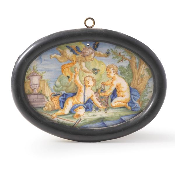 Targa ovale con putti. Italia centrale, XX secolo.