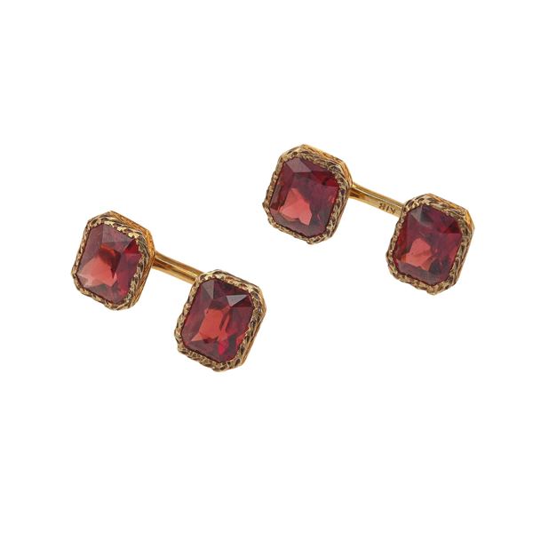 Pair of garnet and gold cufflinks. Case signed Codevilla