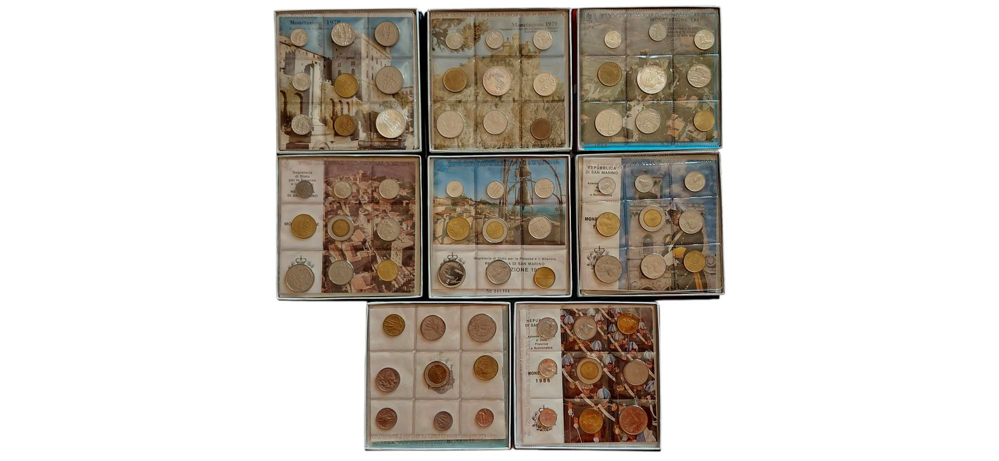 San Marino 1978-1986: 8 divisionali FdC contenenti 3 monete FdC in argento da 500 Lire.
