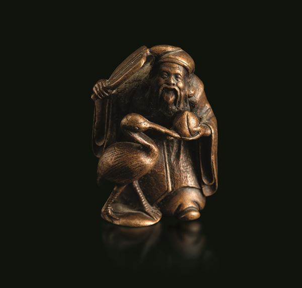 Okimono in bronzo con saggio e airone, Giappone, periodo Meiji (1868-1912)