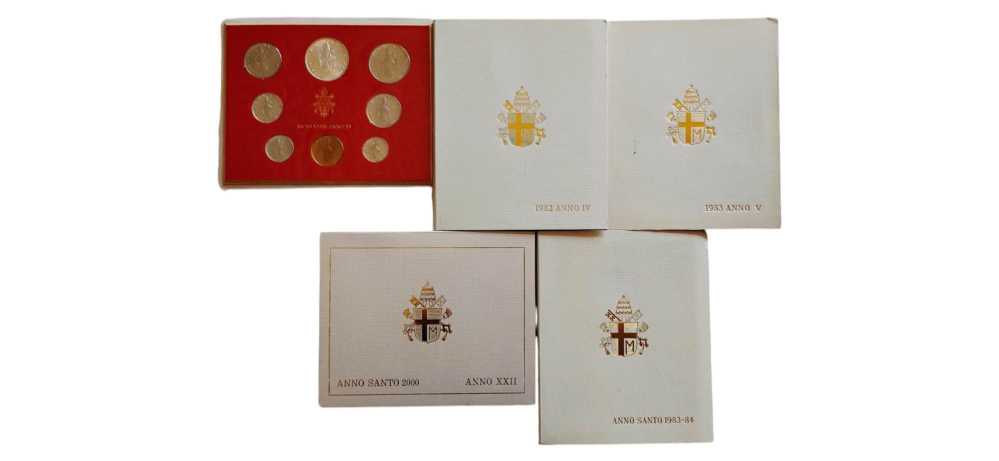Vaticano 1977-2000: lotto composto da 4 divisionali Lire FdC e dal dittico Anno Santo 1983-1984.