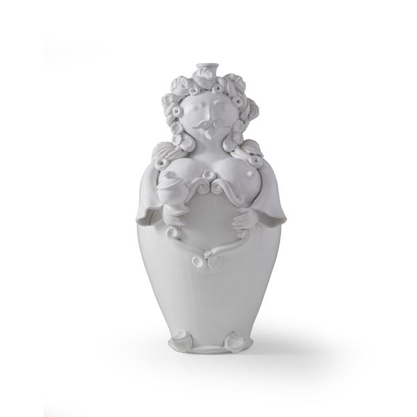 Due pupi portacandela in ceramica bianca