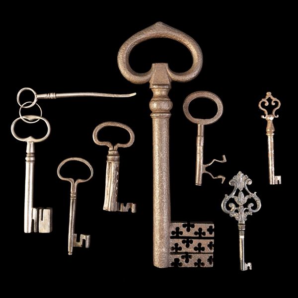 Sette chiavi in ferro forgiato e una in argento stampato e scolpito. Italia settentrionale, XVIII secolo