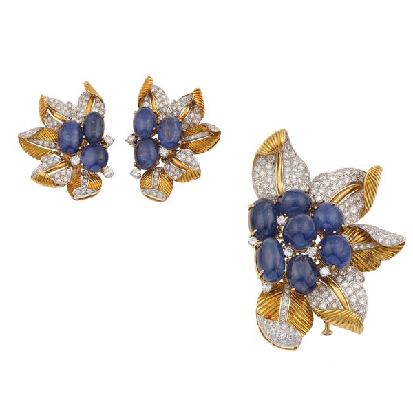 Sabbadini. Demi-parure composta da spilla ed orecchini con zaffiri taglio cabochon per ct 95.00 circa e diamanti per ct 9.50 circa